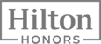 The image shows the Hilton Honors logo, featuring the words "Hilton Honors" in gray within a rectangular border.