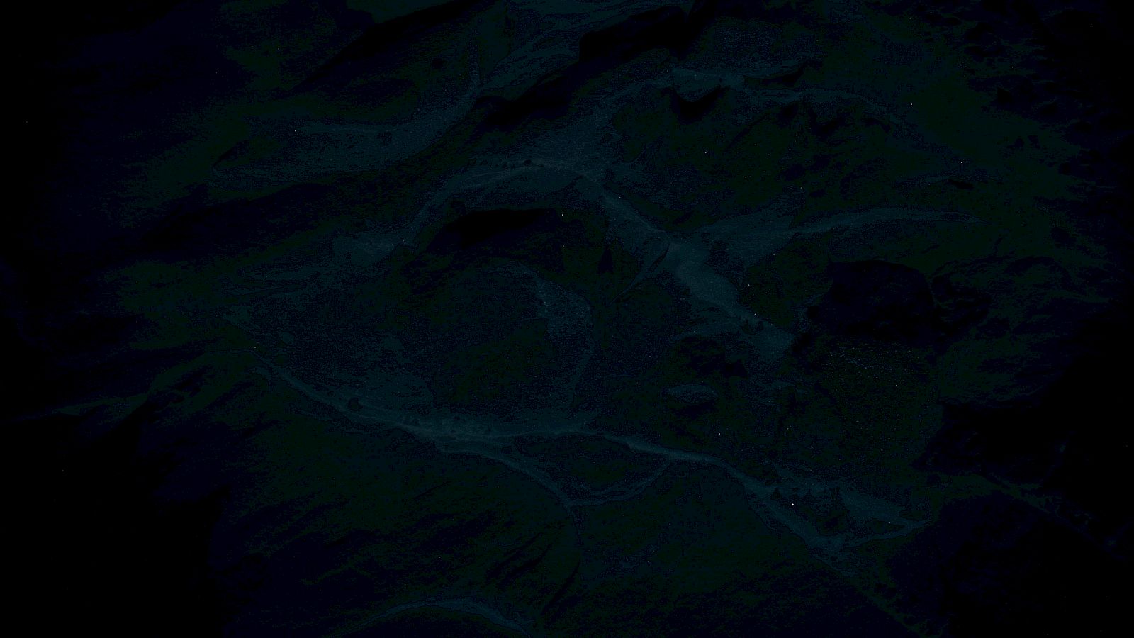 The image appears very dark and unclear, possibly showing a landscape or abstract pattern.